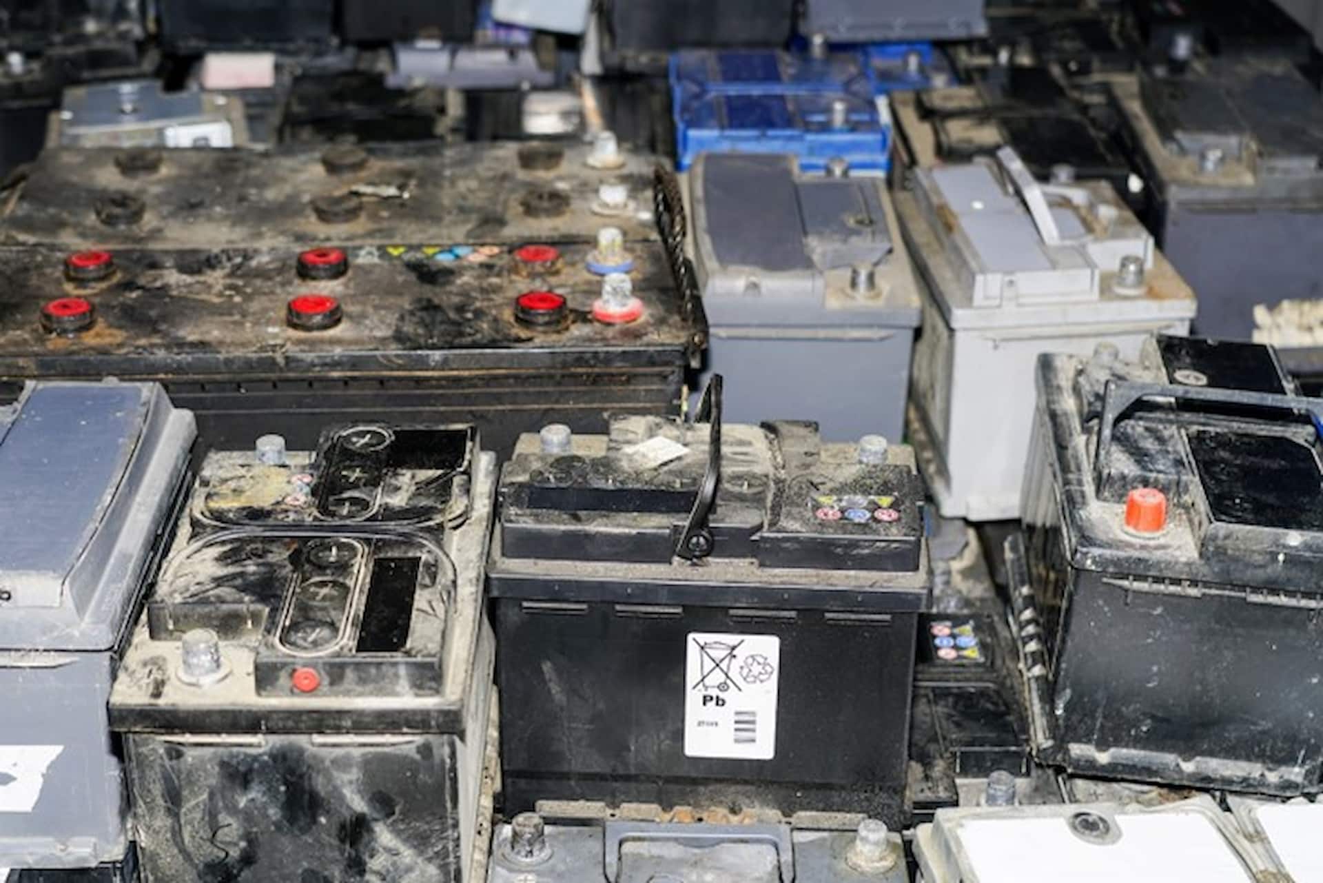 Lead acid batteries waiting to be recycled at metal waste yard