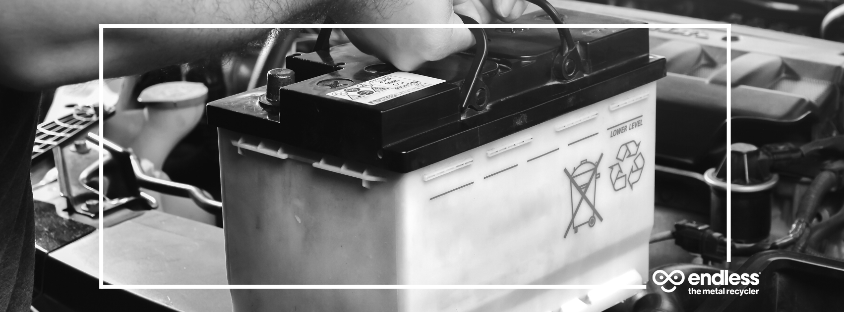 a scrap car battery being removed from a car.