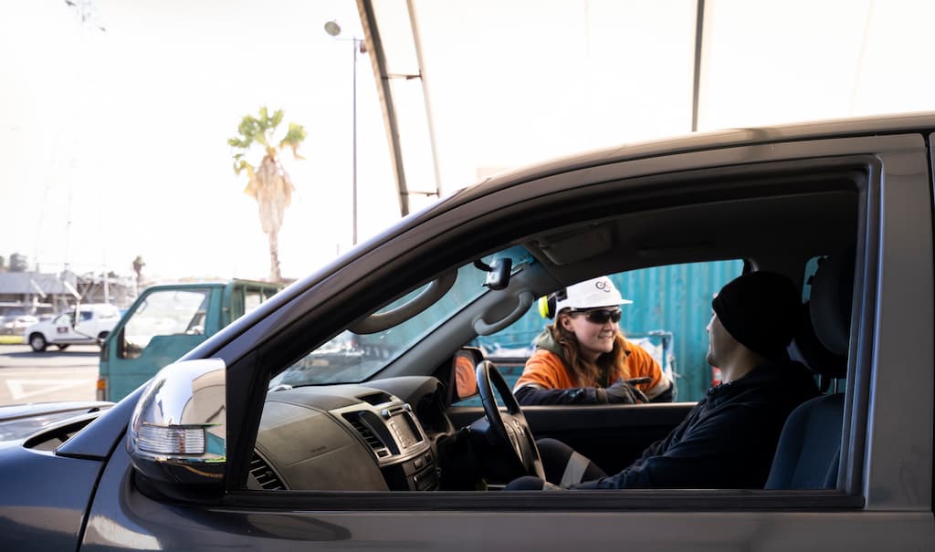 EndlessMetals_LibraryImages-118 Scrap metal drive thru employee speaking to customer.